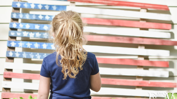 Child says pledge to wooden American Flag, Flags of Valor