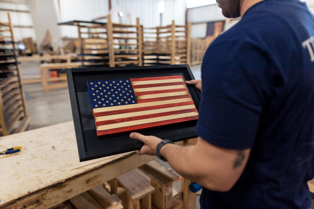 Wooded American Flag held by USA Veteran Craftsman Woodworker