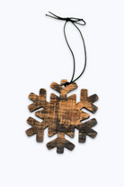 Wooden snowflake ornament made with bourbon barrel wood