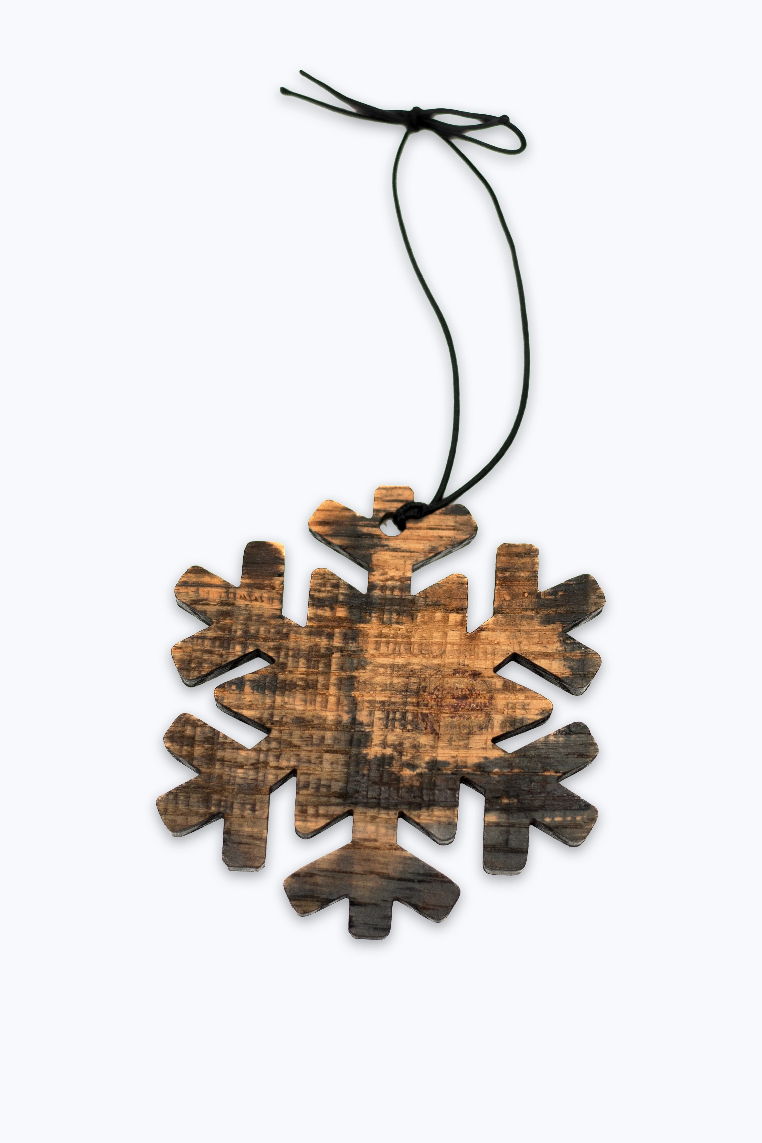 Wooden snowflake ornament made with bourbon barrel wood