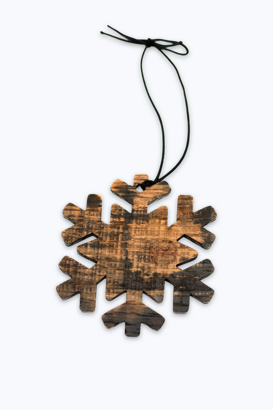 Wooden snowflake ornament made with bourbon barrel wood