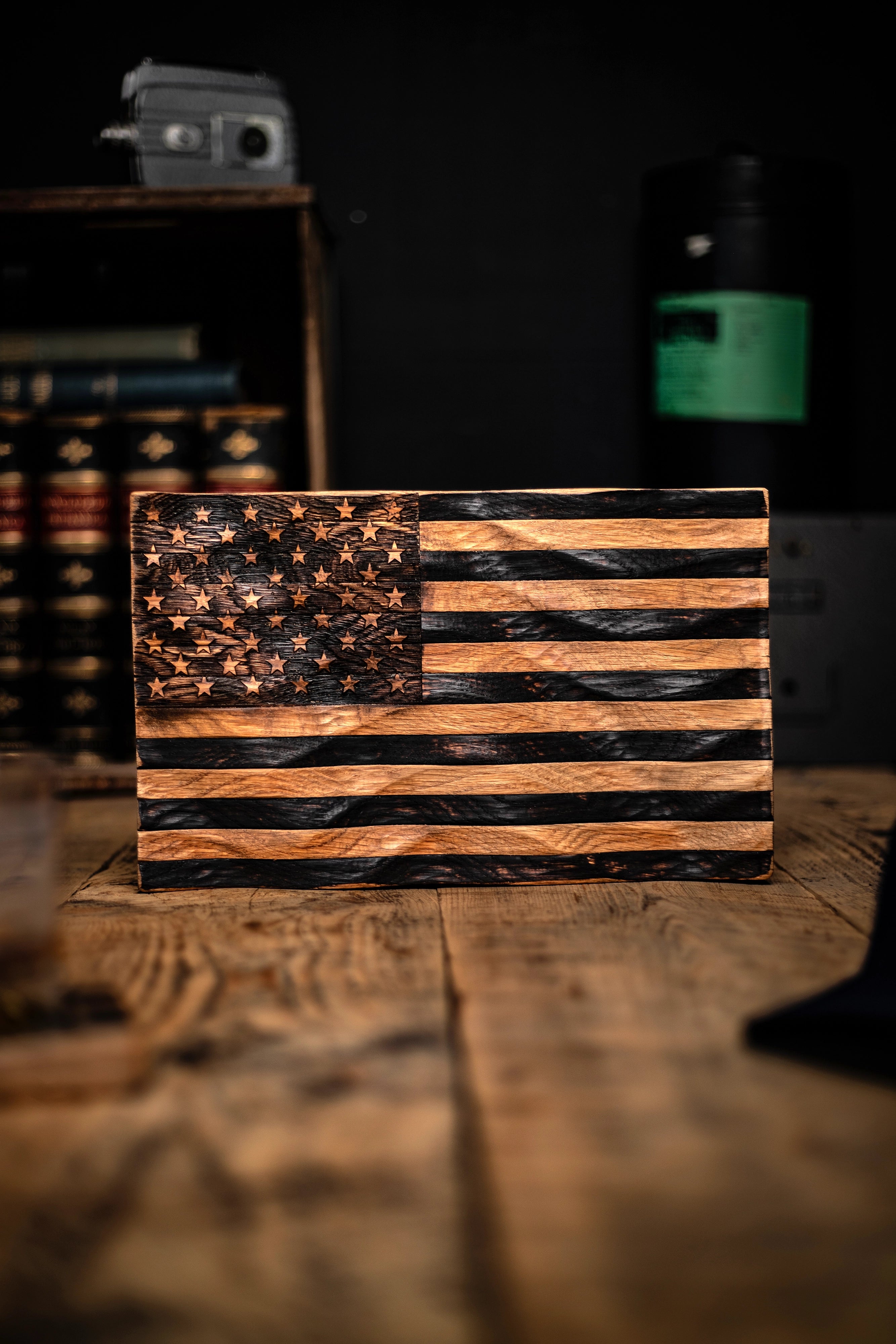Flags of Valor wooden American flag made from bourbon barrel wood on a wooden surface