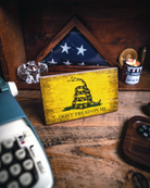 Service Branch Desk Flag featuring Gadsden insignia with a flag in the background.