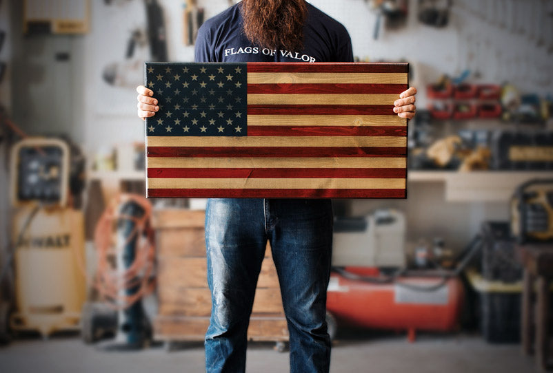 Phantom Fury (S) Wooden American Flag being held by a Combat Veteran